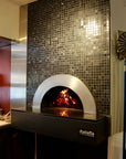 Milano fired oven enclosed within a decorated wall with custom tiling.