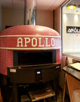 A red Napoli fired oven with a custom branded tiling for Apollo.