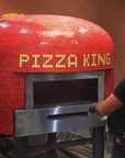 A bright red Napoli fired oven with a custom branded tiling for Pizza King.