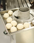 Finished dough balls made by the Roundi Dough Rounder.